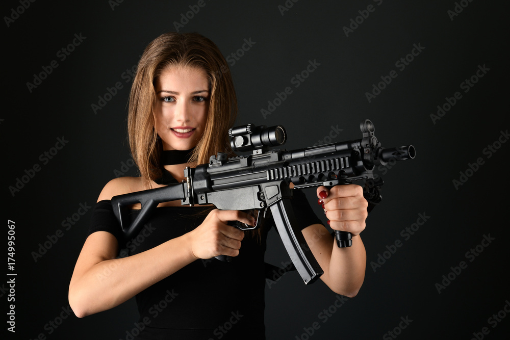 Beautiful woman holding gun