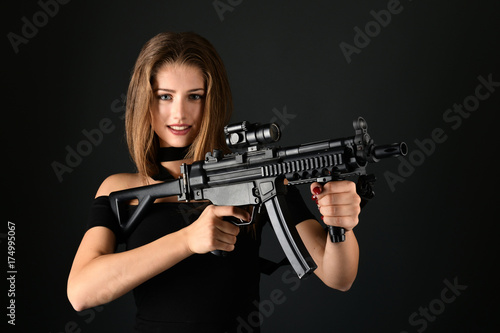 Beautiful woman holding gun © muro