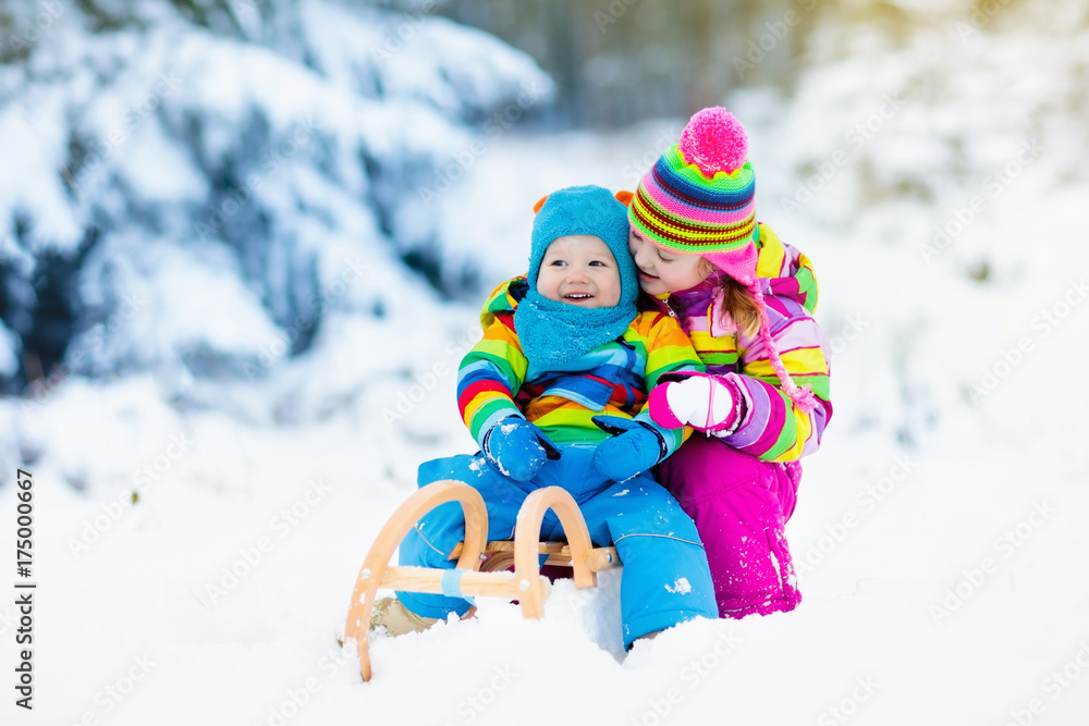 Kids on sleigh ride. Children sledding. Winter snow fun. Kids on sleigh ride. Children sledding. Winter snow fun.