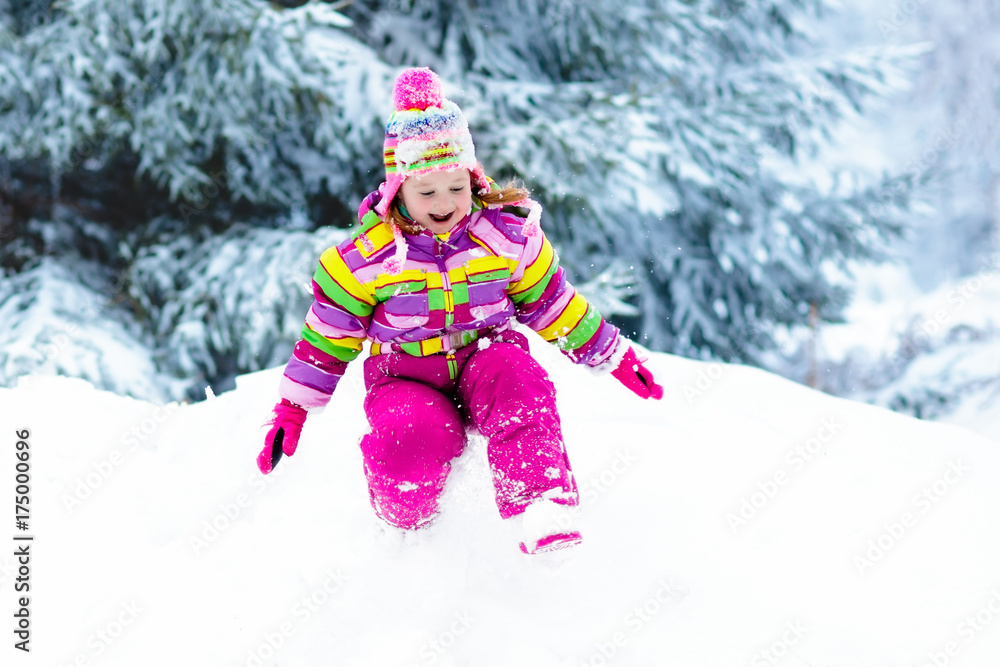 Child playing with snow in winter. Kids outdoors. Child playing with snow in winter. Kids outdoors.