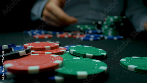 Obraz na plátne Close-Up of Man Throwing a Poker Chips in slow motion