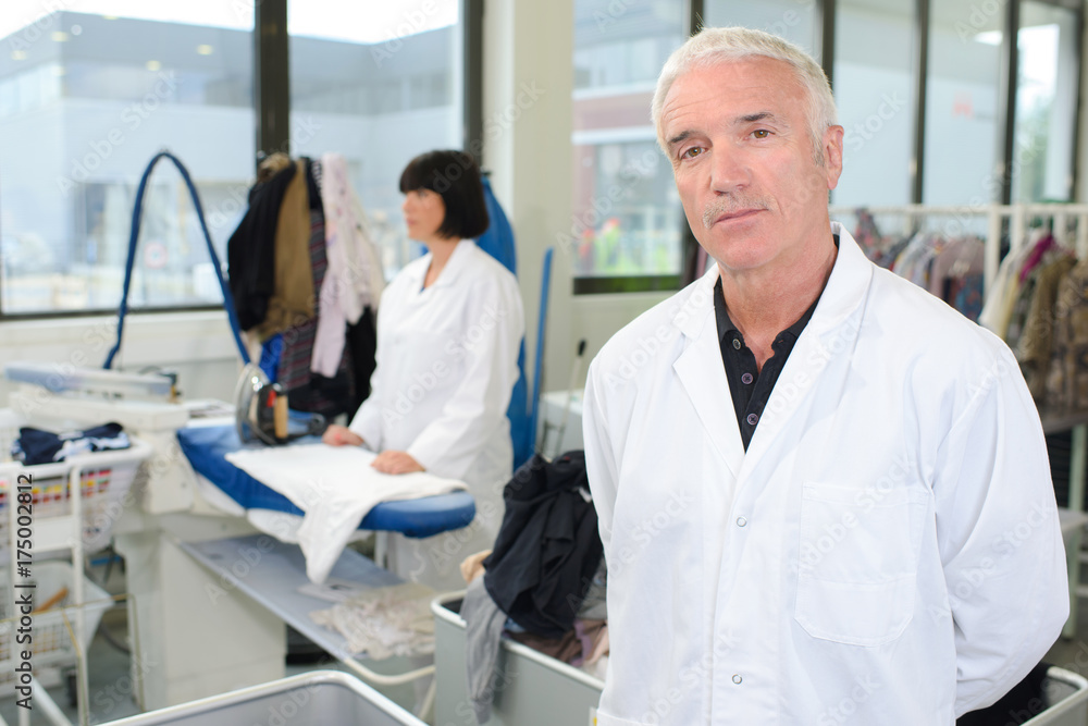 Portrait of man in professional laundrette Portrait of man in professional laundrette