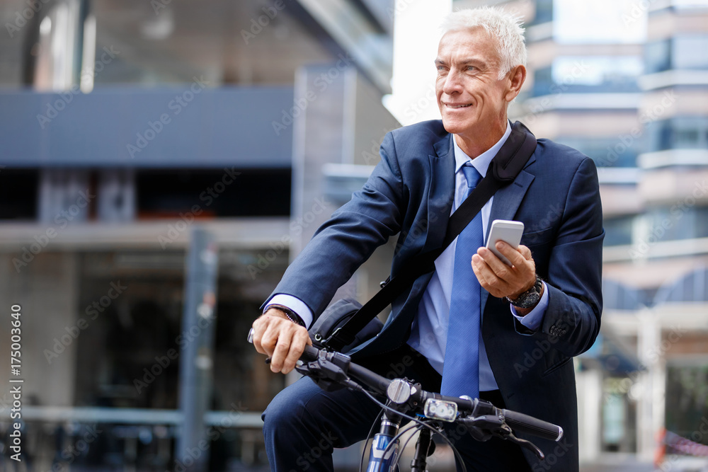 Successful businessman riding bicycle Successful businessman riding bicycle