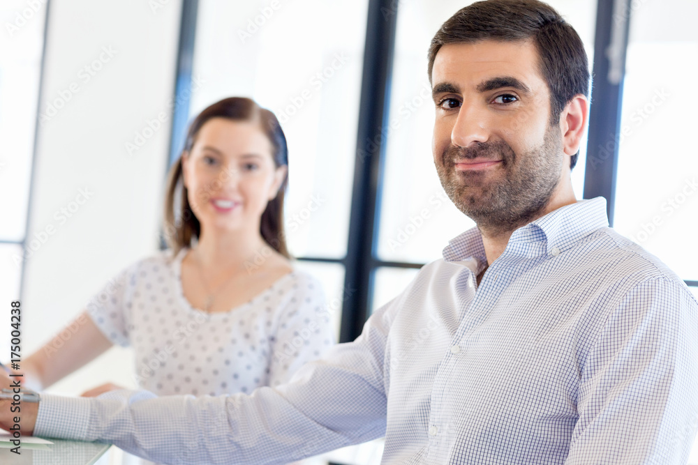 Image of two young business people in office Image of two young business people in office