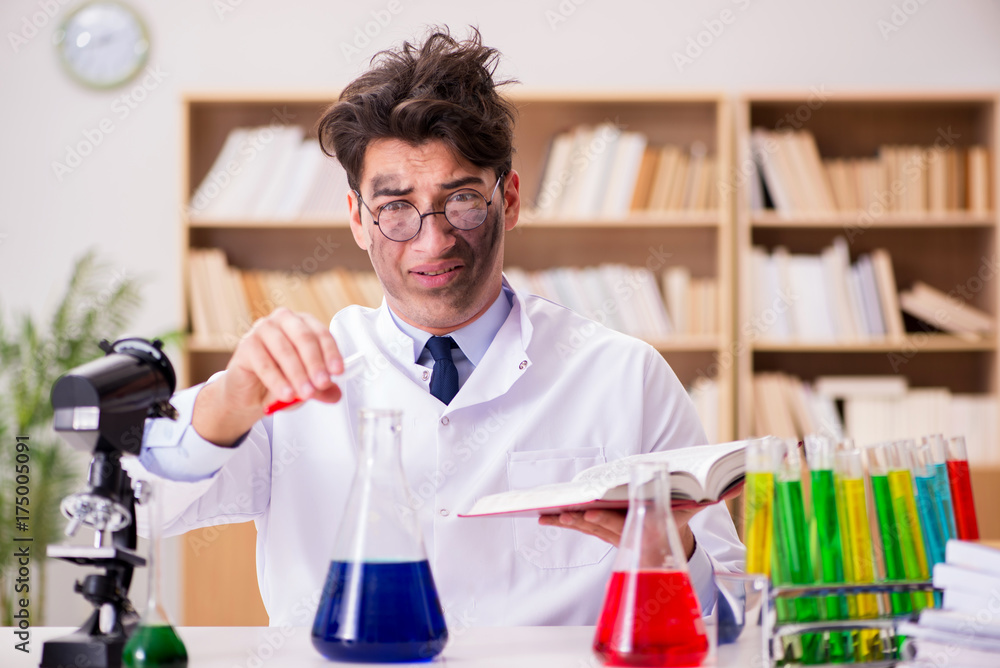 Mad crazy scientist doctor doing experiments in a laboratory Mad crazy scientist doctor doing experiments in a laboratory