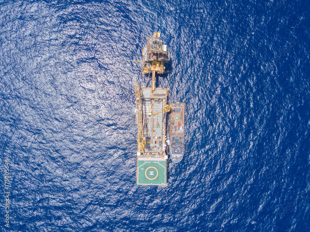 Aerial View of Tender Drilling Oil Rig (Barge Oil Rig) in The Middle of The Ocean Aerial View of Tender Drilling Oil Rig (Barge Oil Rig) in The Middle of The Ocean
