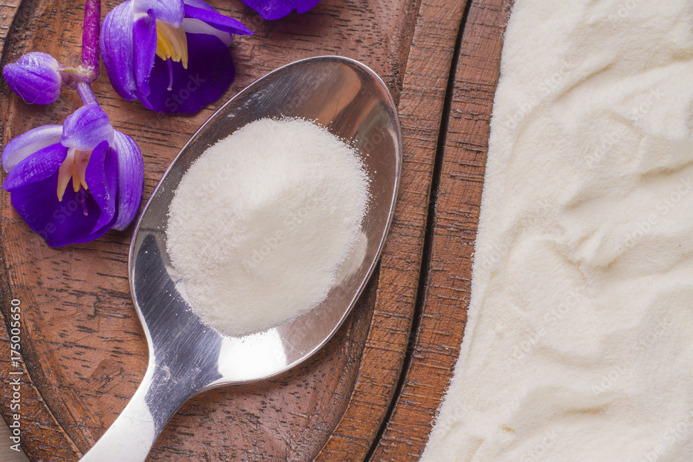 Hydrolyzed Collagen Protein on Wood Background Hydrolyzed Collagen Protein on Wood Background