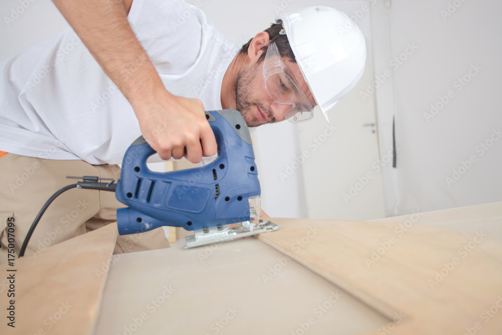 Man using jigsaw Man using jigsaw