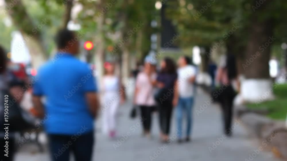 Time lapse, people walking in the street on background cars and trees, blurry Time lapse, people walking in the street on background cars and trees, blurry