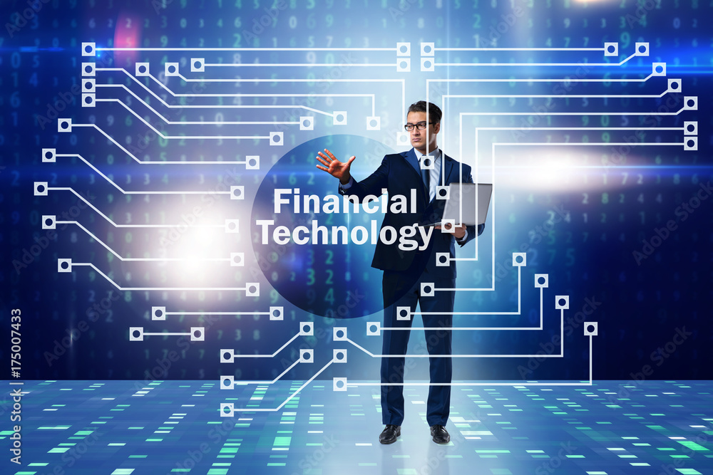Businessman pressing buttons in fintech concept Businessman pressing buttons in fintech concept
