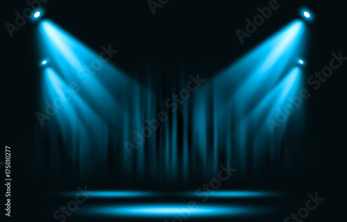 Stage lights. Blue spotlight with certain through the darkness.