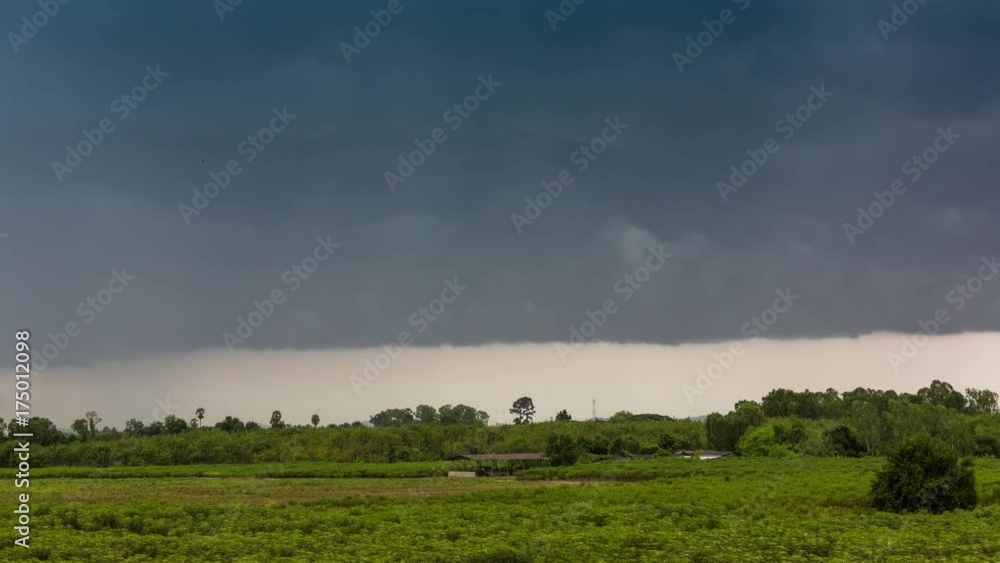 Storm and dark cloud with raining over meadow ,Time lapse 4K Storm and dark cloud with raining over meadow ,Time lapse 4K