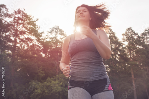 Overweight woman running. Weight loss concept.