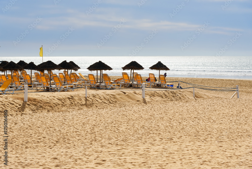 Umbrellas and chaise lounges on beach. Agadir. Morocco Umbrellas and chaise lounges on beach. Agadir. Morocco