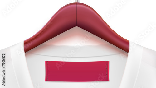 Horizontal template for advertising of sales or new arrivals. White blouse and empty tag on the collar, wooden clothes hangers. Place for your text on white tag on clothing