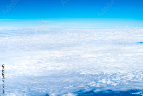 Blue sky and Cloud Top view from airplane window Nature background.