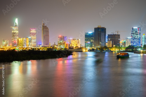 Night view of Business and Administrative Center of Ho Chi Minh city on Saigon riverbank in twilight, Vietnam. 
