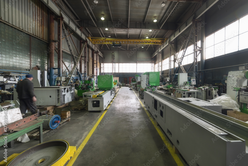 A long shop of a factory for the production of metalworking machines A long shop of a factory for the production of metalworking machines