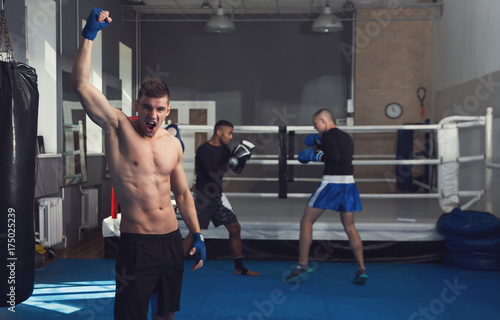 Champion. Male boxers. Taking a box in the gym. Male kind of relaxation. Sports training.