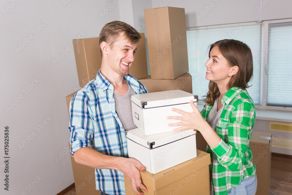 Young Couple Moving In To New Home Together Young Couple Moving In To New Home Together