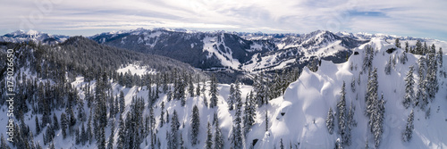 Aerial of Winter Resort from Snowy Peak in Cascade Mountain Range © openrangestock