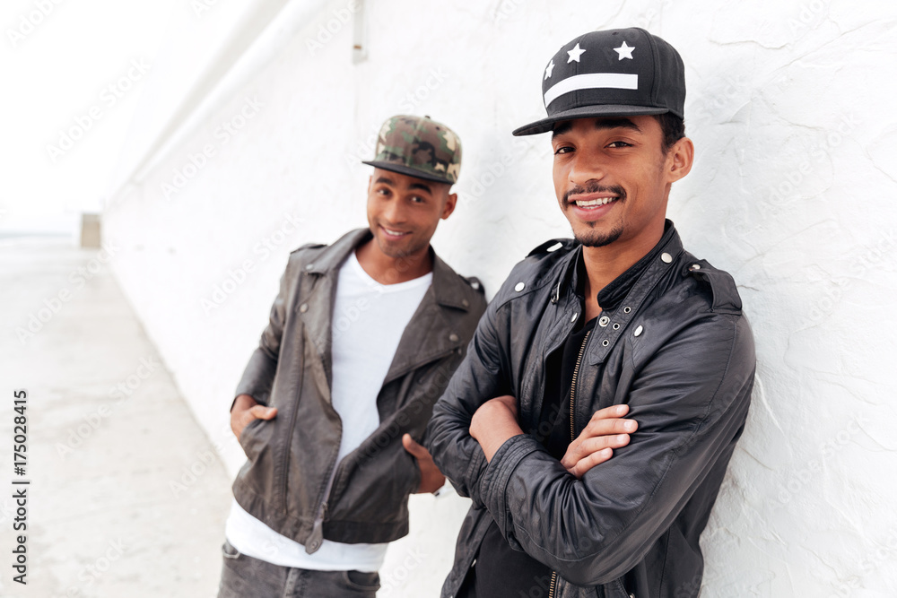 Two young african men friends standing outdoors Two young african men friends standing outdoors