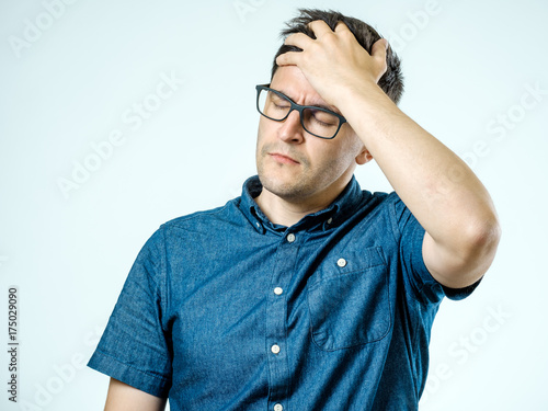 Frustrated man with headache isolated