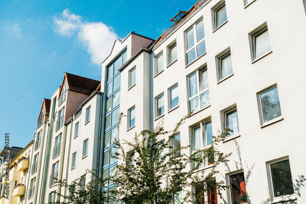 typical houses in berlin with clouds