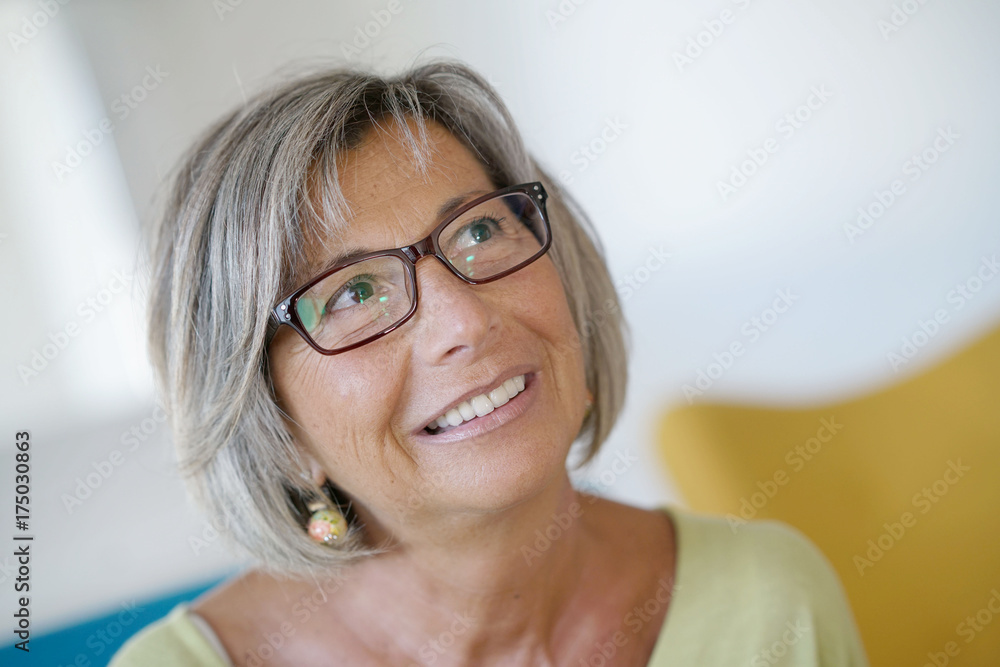 Portrait of smiling senior woman with eyeglasses Portrait of smiling senior woman with eyeglasses