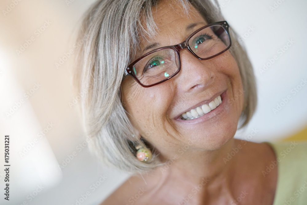 Portrait of smiling senior woman with eyeglasses Portrait of smiling senior woman with eyeglasses