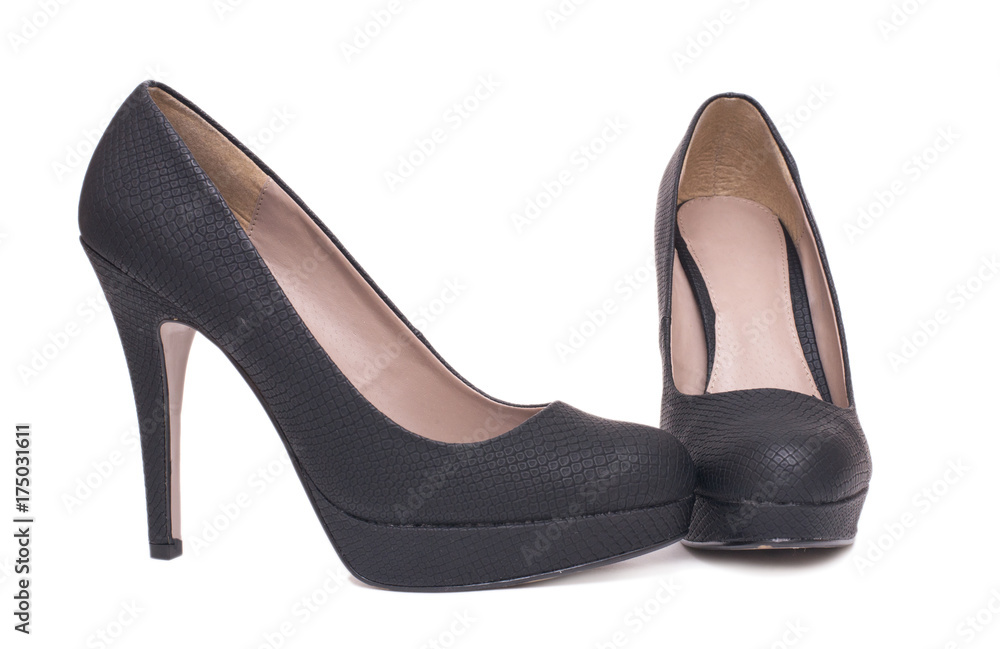 Pair of black elegant high heel female shoes isolated on white background. Pair of black elegant high heel female shoes isolated on white background.