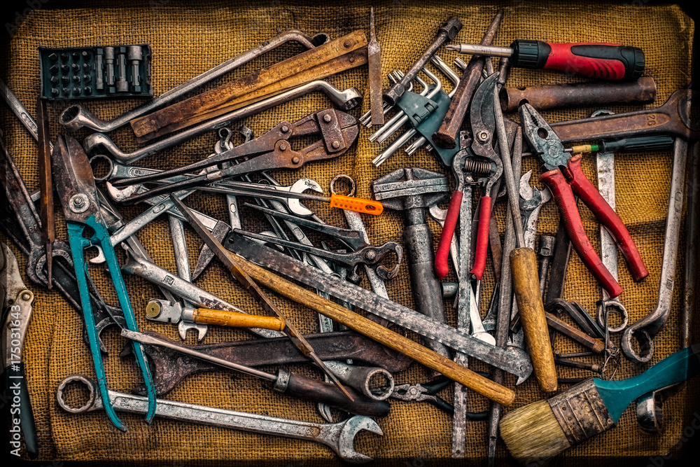 Different kinds of tools and keys on jute bag Different kinds of tools and keys on jute bag