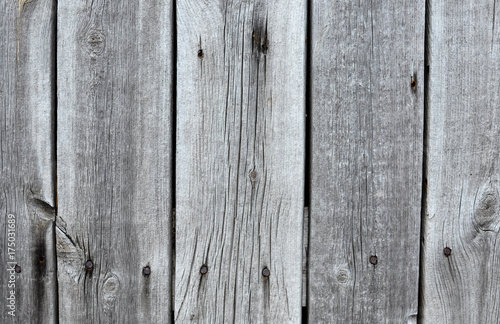 Texture of old gray wooden fence panels. Rustic background.