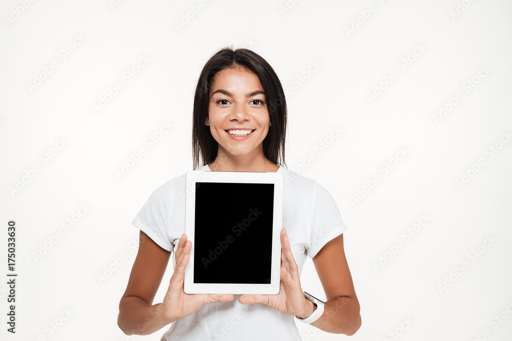 Portrait of a happy smiling woman showing blank screen tablet Portrait of a happy smiling woman showing blank screen tablet