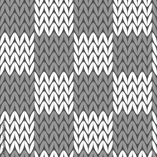 Seamless knitted background. Knitted pattern. Grey sweater. Textile rapport.