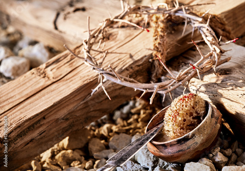 Wooden cross among crucifixion symbols