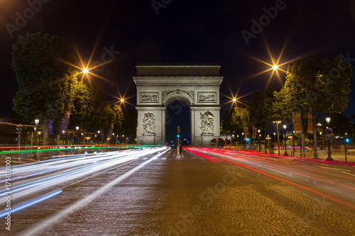 Paris Arc de Triomphe Triumphal Arch at Chaps Elysees at night, Paris, France. Architecture and landmarks of Paris. Postcard of Paris © aiisha
