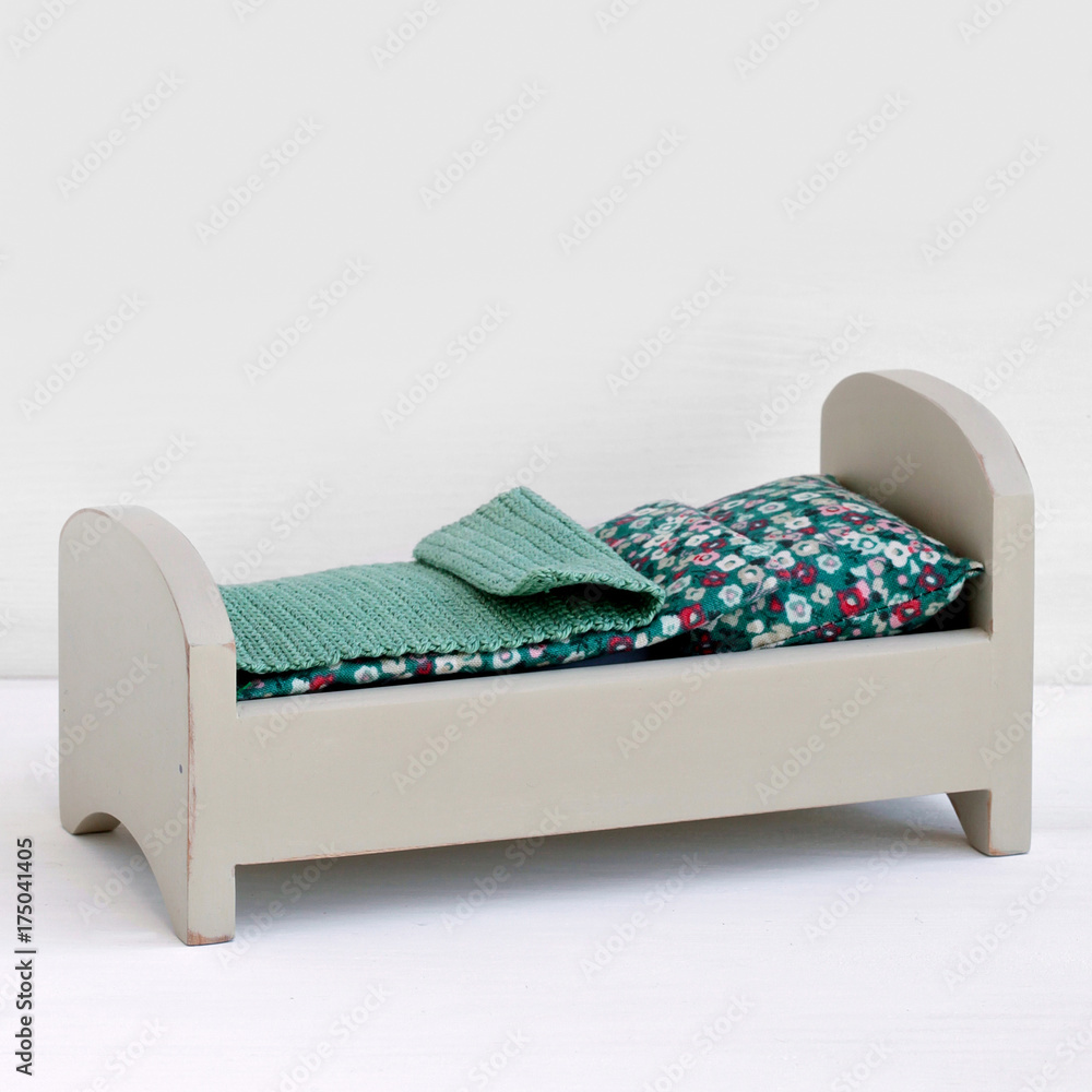 Handmade wooden miniature bed for dollhouse. Stock Photo | Adobe Stock