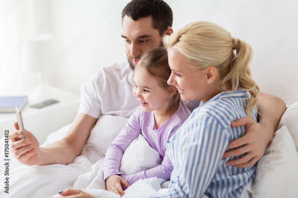 happy family taking selfie by smartphone at home happy family taking selfie by smartphone at home