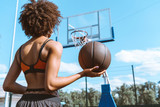 african-american woman holding basketball