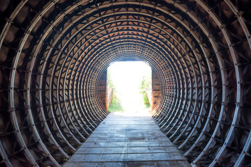Fotobehang Tunnel Tunnel met stralend licht aan einde  © Pavlo Vakhrushev
