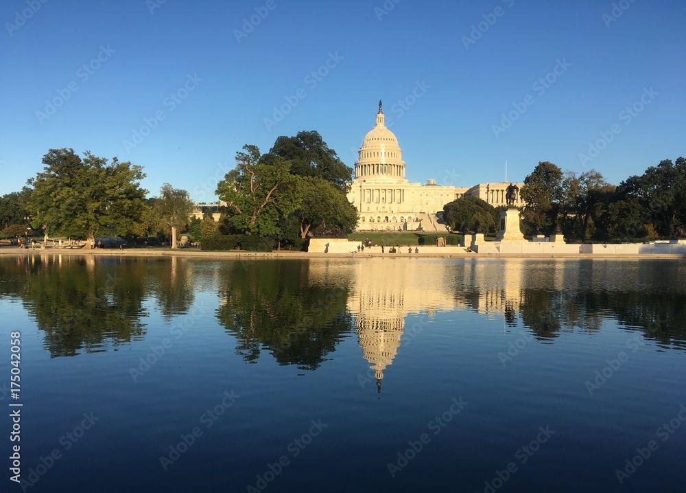The US Capitol and its reflection on a fall afternoon
