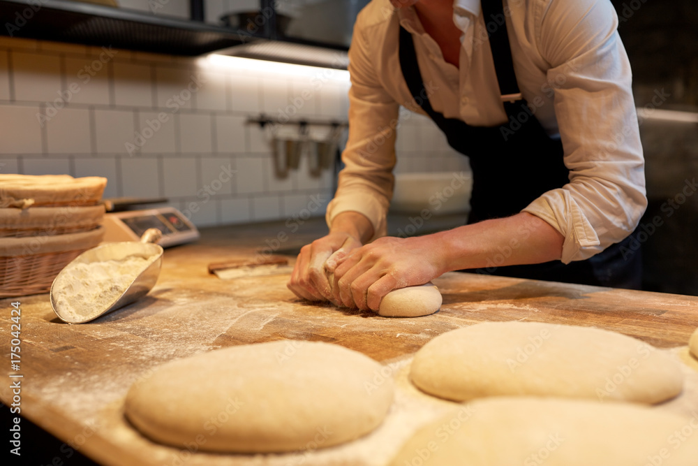 baker making bread dough at bakery kitchen baker making bread dough at bakery kitchen