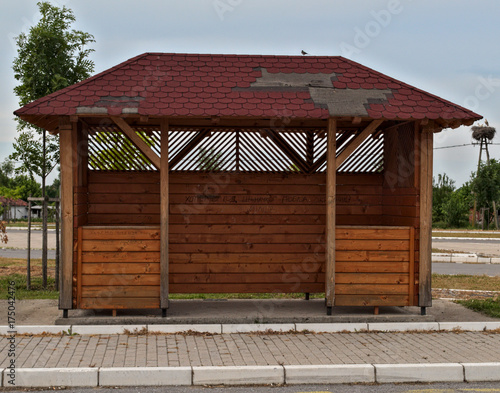 Wooden bus station at cloudy day © Zeljko