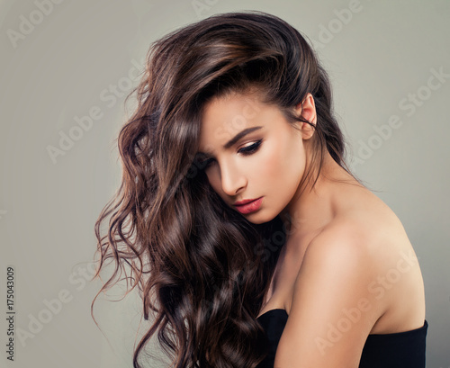 Sexy Young Fashion Model. Alluring Woman with Wavy Hair