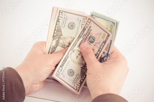 HANDS COUNTING DOLLARS CONCEPT