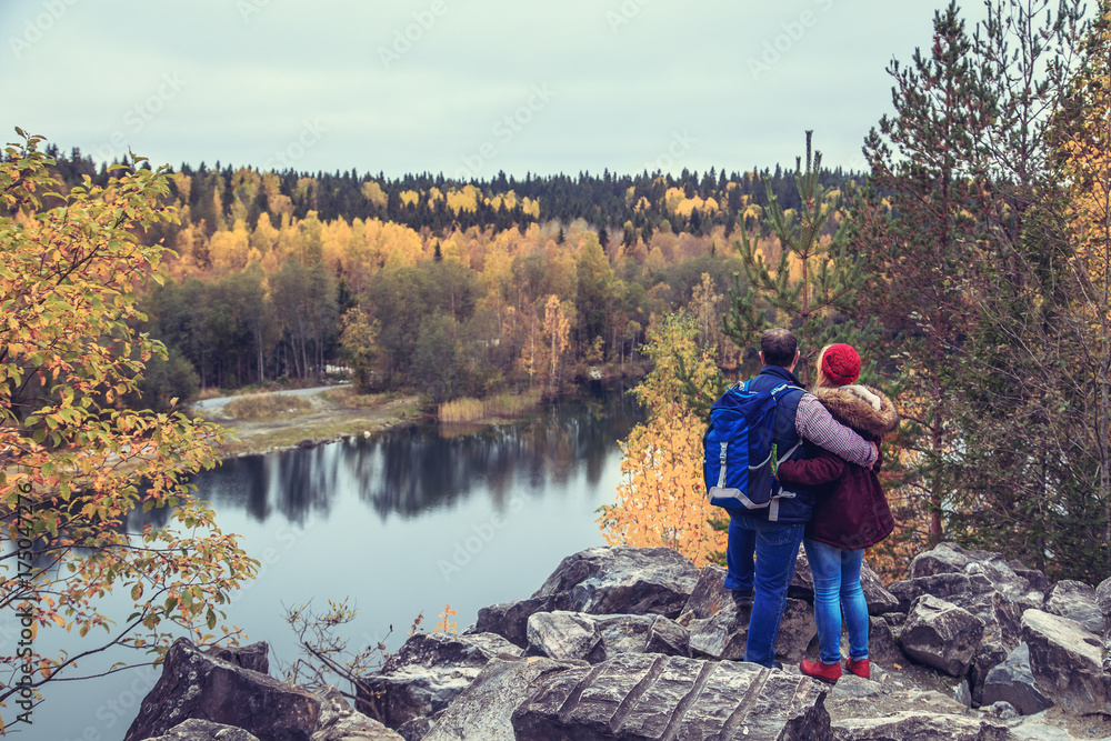 Family travelers looking at a mountain lake in Marble Canyon. Family travelers looking at a mountain lake in Marble Canyon.