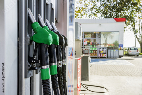 Gasoline and diesel distributor at the gas station. Gas pump nozzles. photo