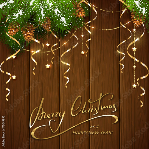 Merry Christmas with decorations and streamers on brown wooden background
