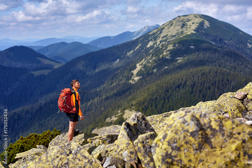 Male traveler from back in the mountains Male traveler from back in the mountains
